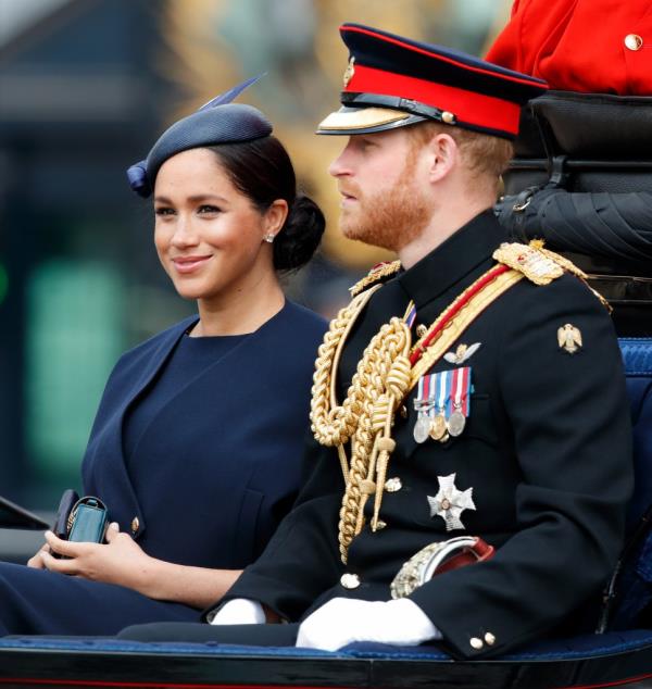 Prince Harry and Meghan Markle smiling. 
