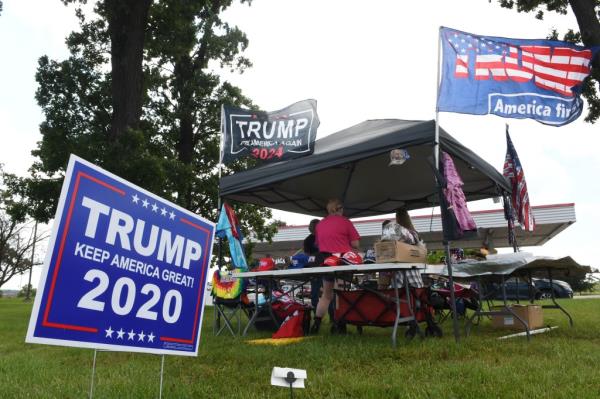 A Trump souvenir stand was open for business in front of a gas station in Racine Sunday June 16, 2024.