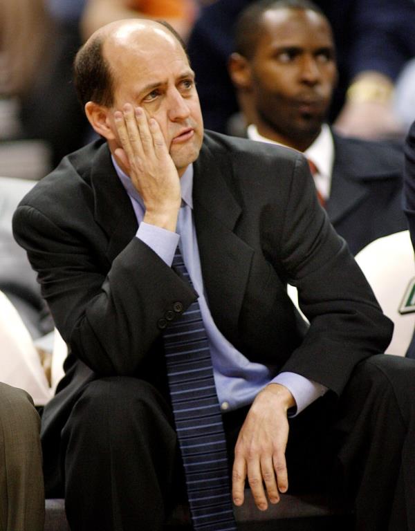 Houston Rockets coach Jeff Van Gundy reacting to a call during NBA basketball game, holding his hand to his face