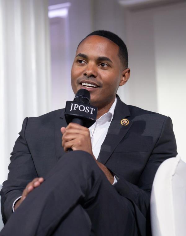 Rep. Ritchie Torres (D-NY) speaking at The Jerusalem Post New York co<em></em>nference on June 03, 2024, holding a microphone.