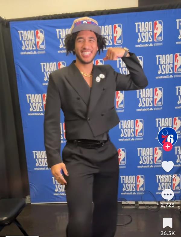 Jared McCain dances in his new 76ers hat after being drafted by the team at No. 16 overall.