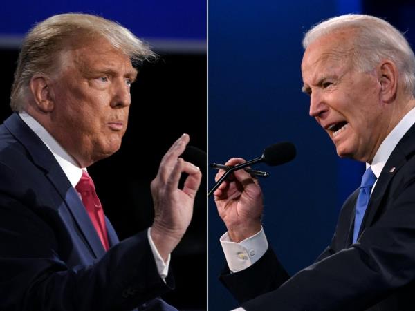 This combination of pictures created on October 22, 2020 shows US President Do<em></em>nald Trump (L) and Democratic Presidential candidate and former US Vice President Joe Biden during the final presidential debate at Belmont University in Nashville, Tennessee, on October 22, 2020. 